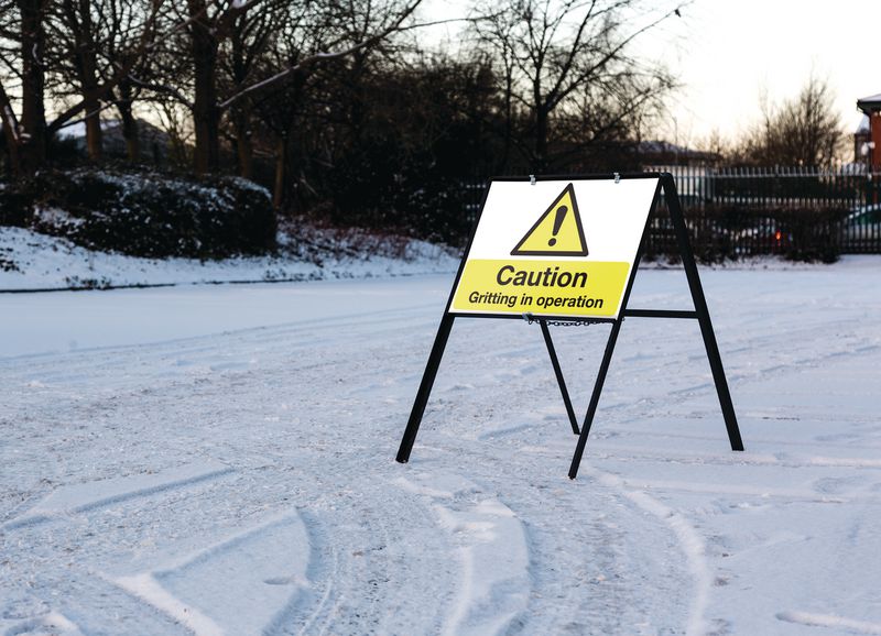 Caution Gritting In Operation - Stanchion Winter Car Park Sign